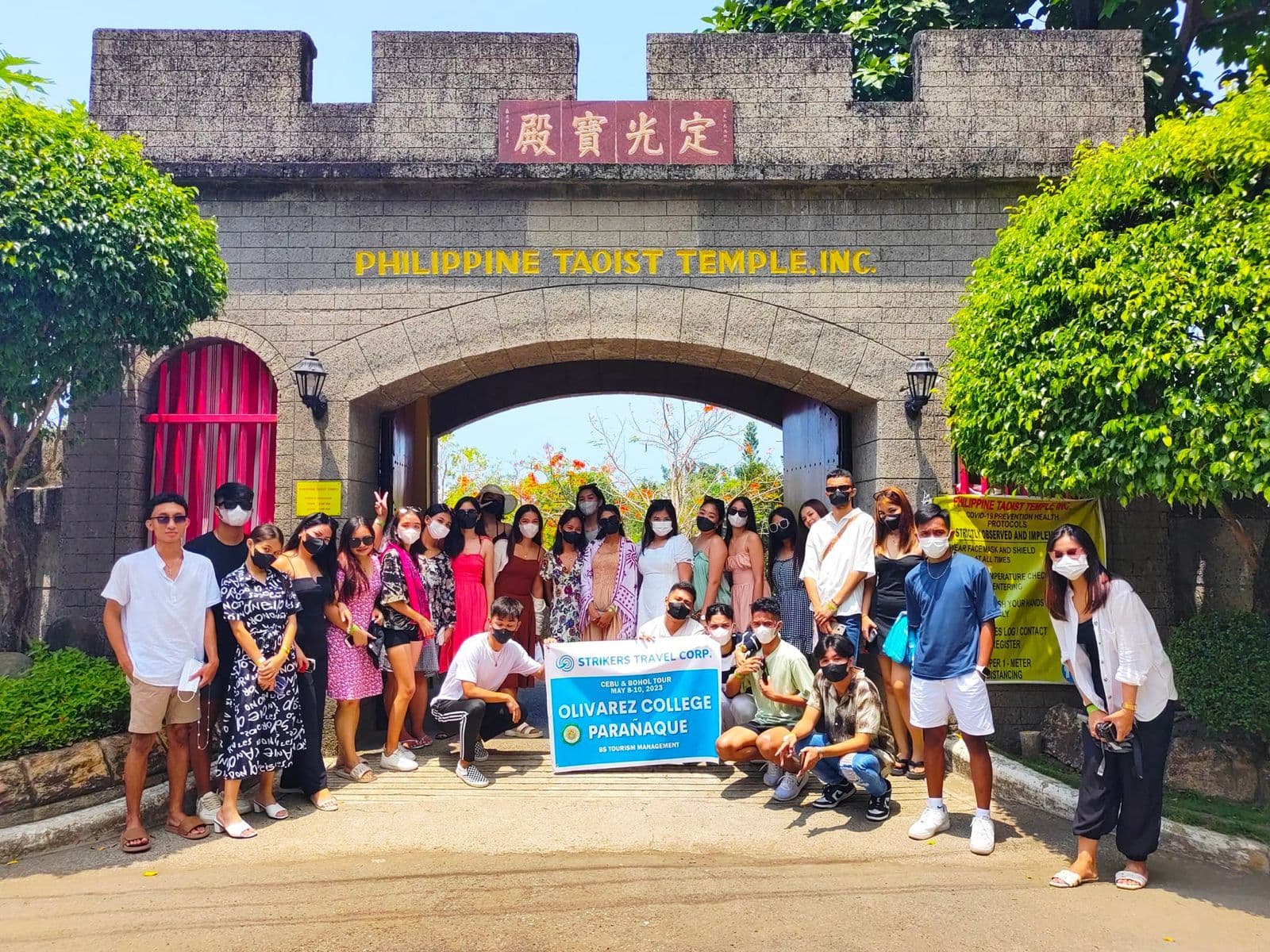 Beautiful beach sunset with travelers